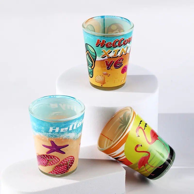 Clear beach shot glasses with colorful seaside themed prints