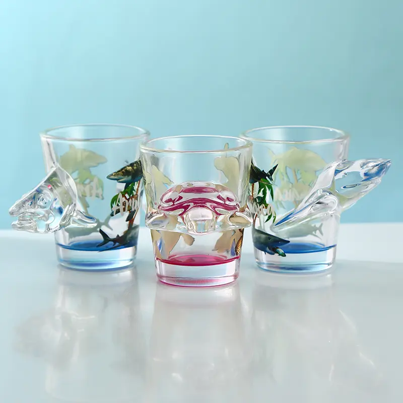 animal-themed-shot-glasses Animal themed shot glasses featuring sea turtle and dolphin designs
