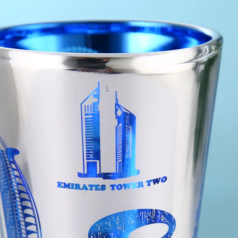 Blue electroplated shot glass close-up of rim and decorative finish