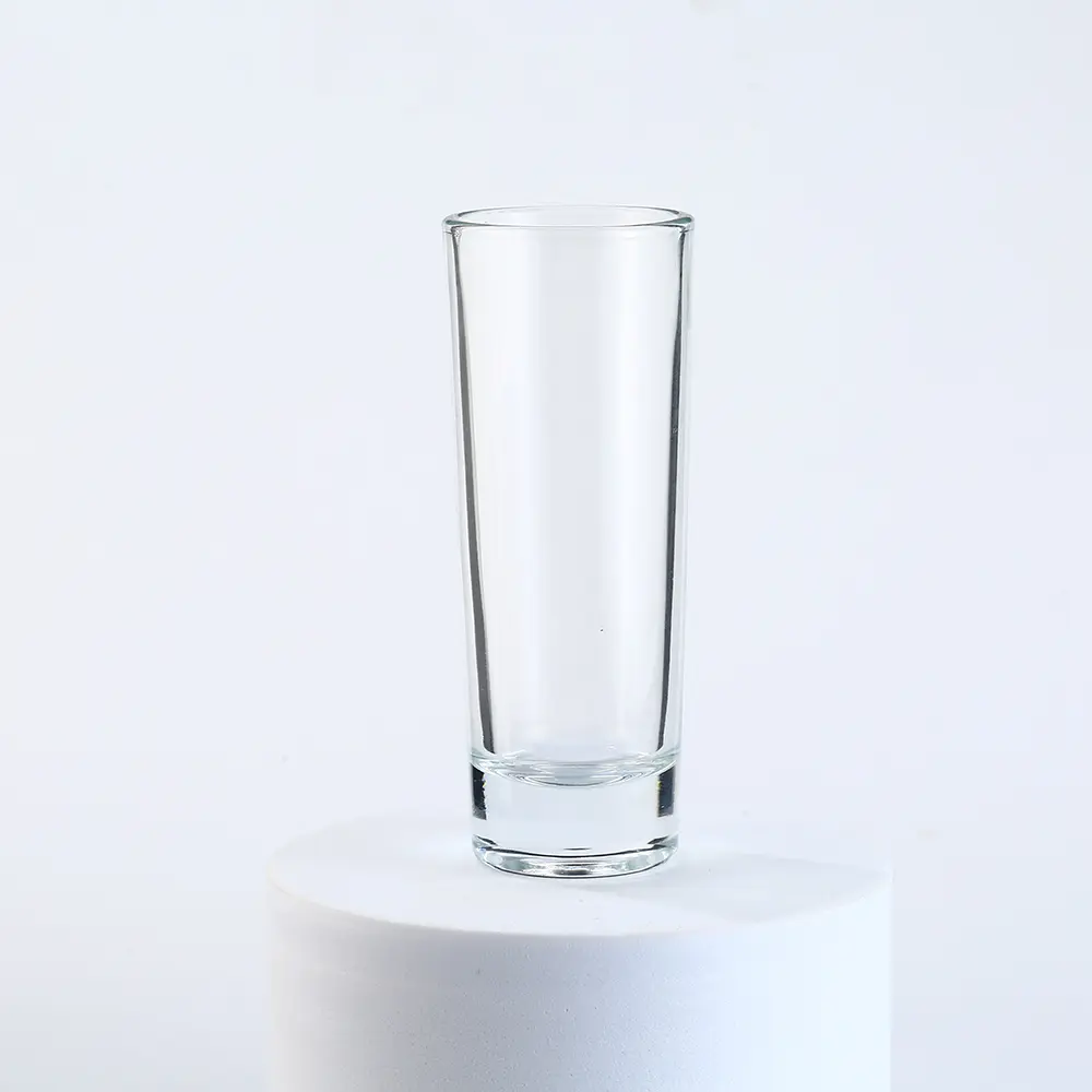 Clear tall thin shot glass with thick base for liquor and spirits