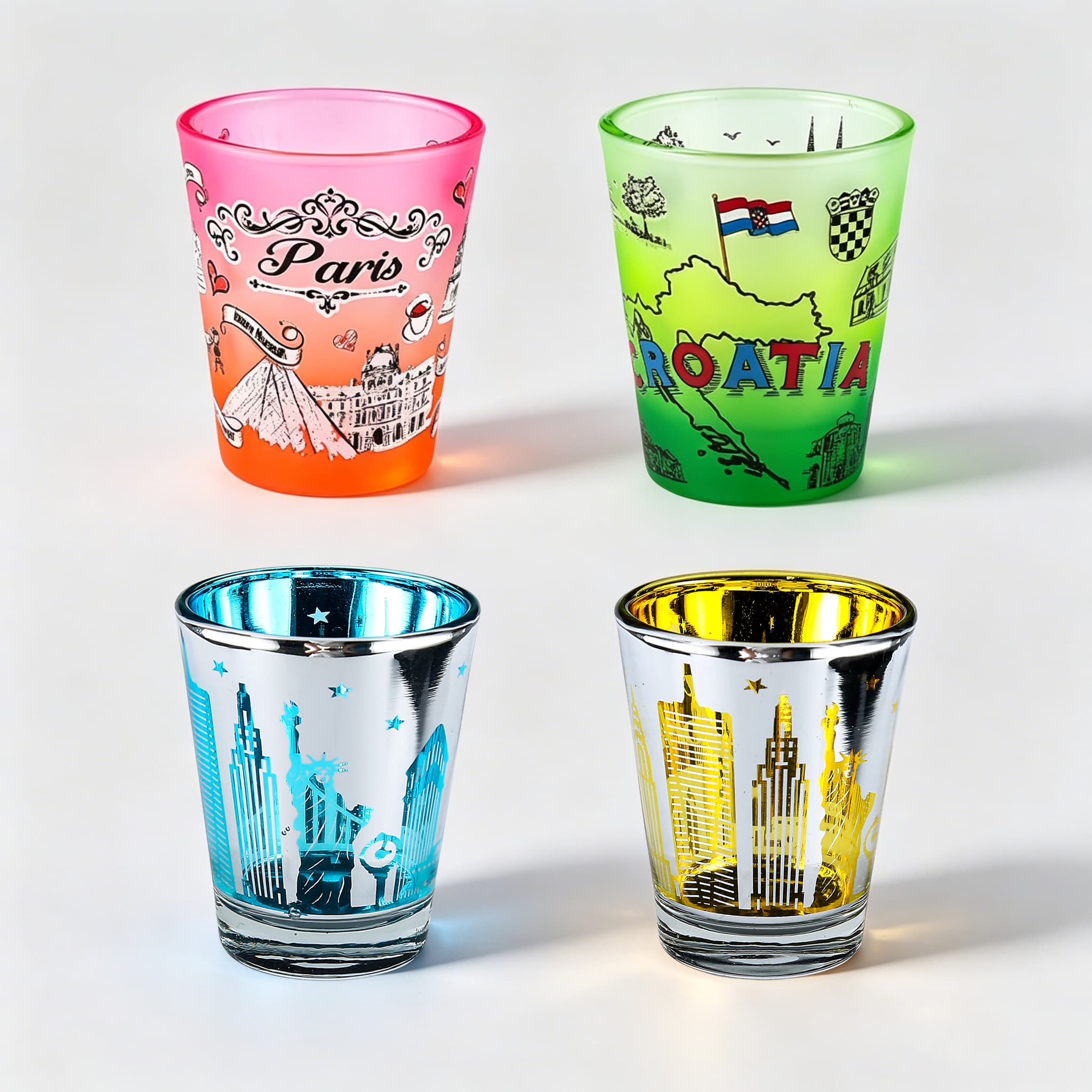 Colored and electroplated shot glasses with metallic and vibrant finishes