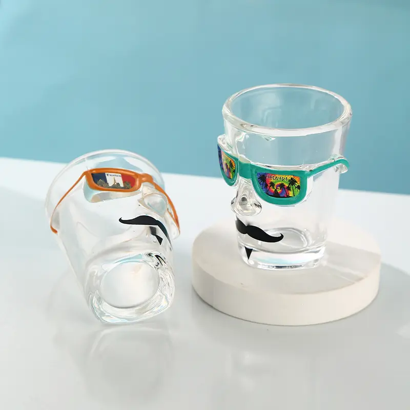 Bottom view of custom face shot glass with sunglasses decoration