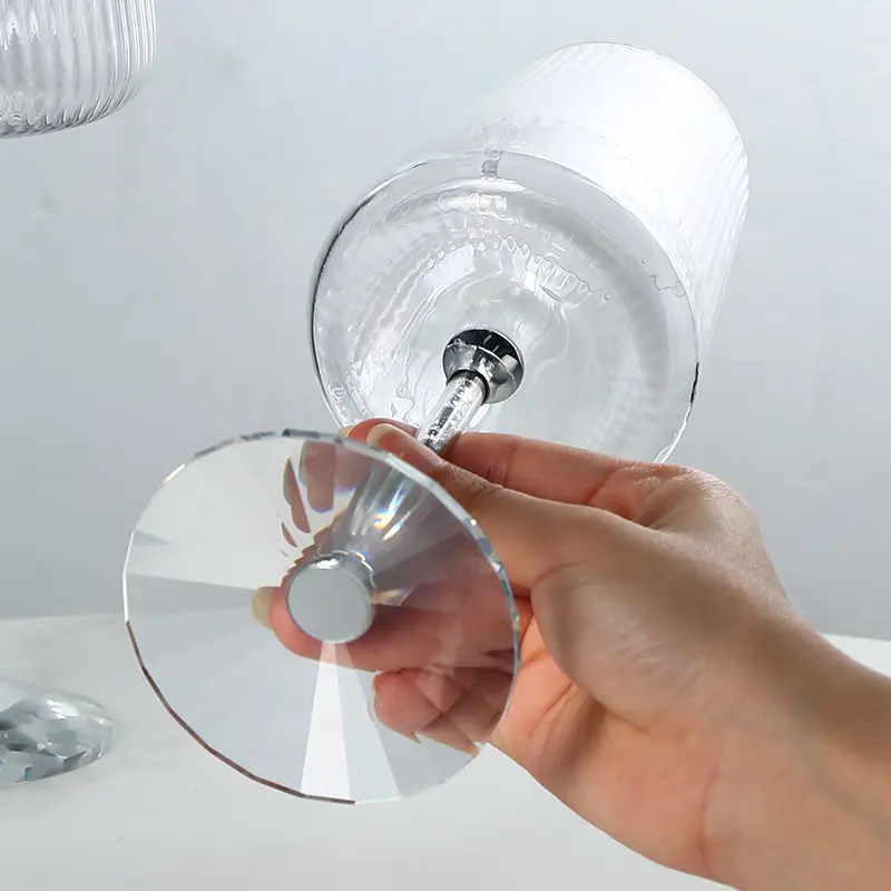 Modern clear glass wine goblet with vertical ribbed texture and crystal-style base