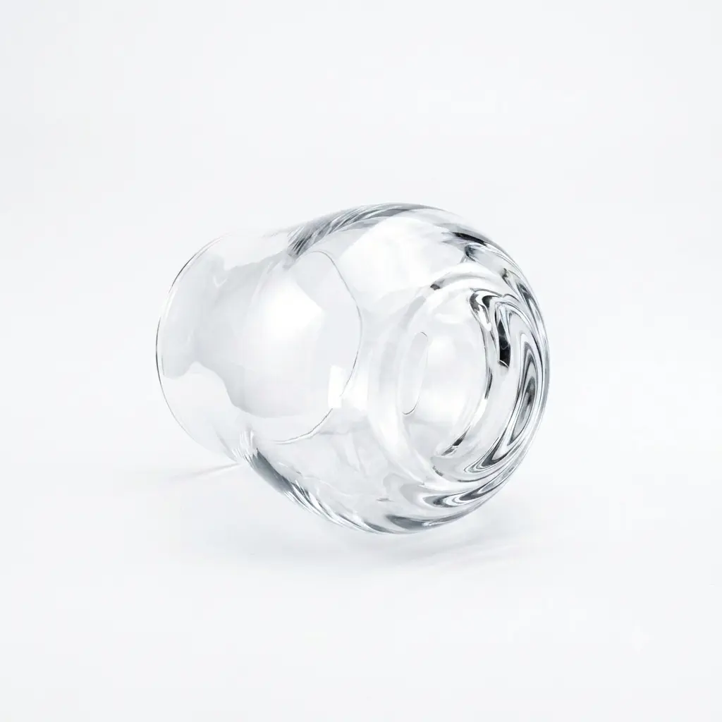 Bottom view of a scotch drinking glass with thick crystal base