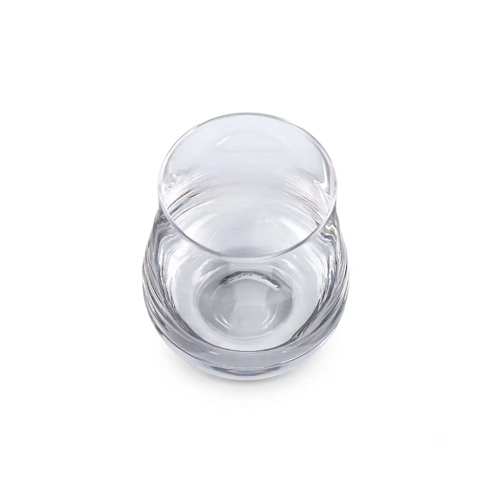 Top view of a scotch drinking glass with curved whisky tasting design