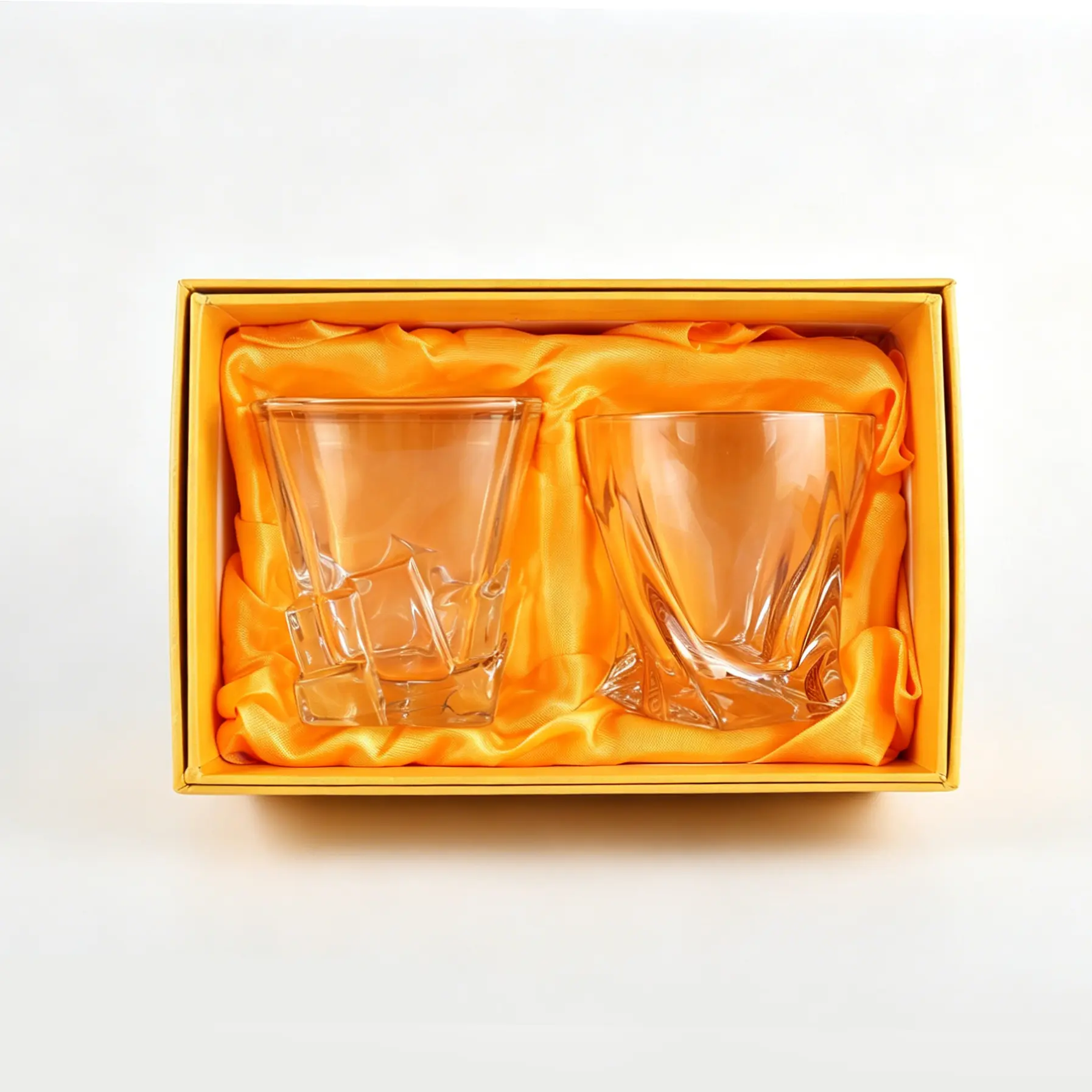 Square bottom whiskey tumbler set in orange satin lined packaging.