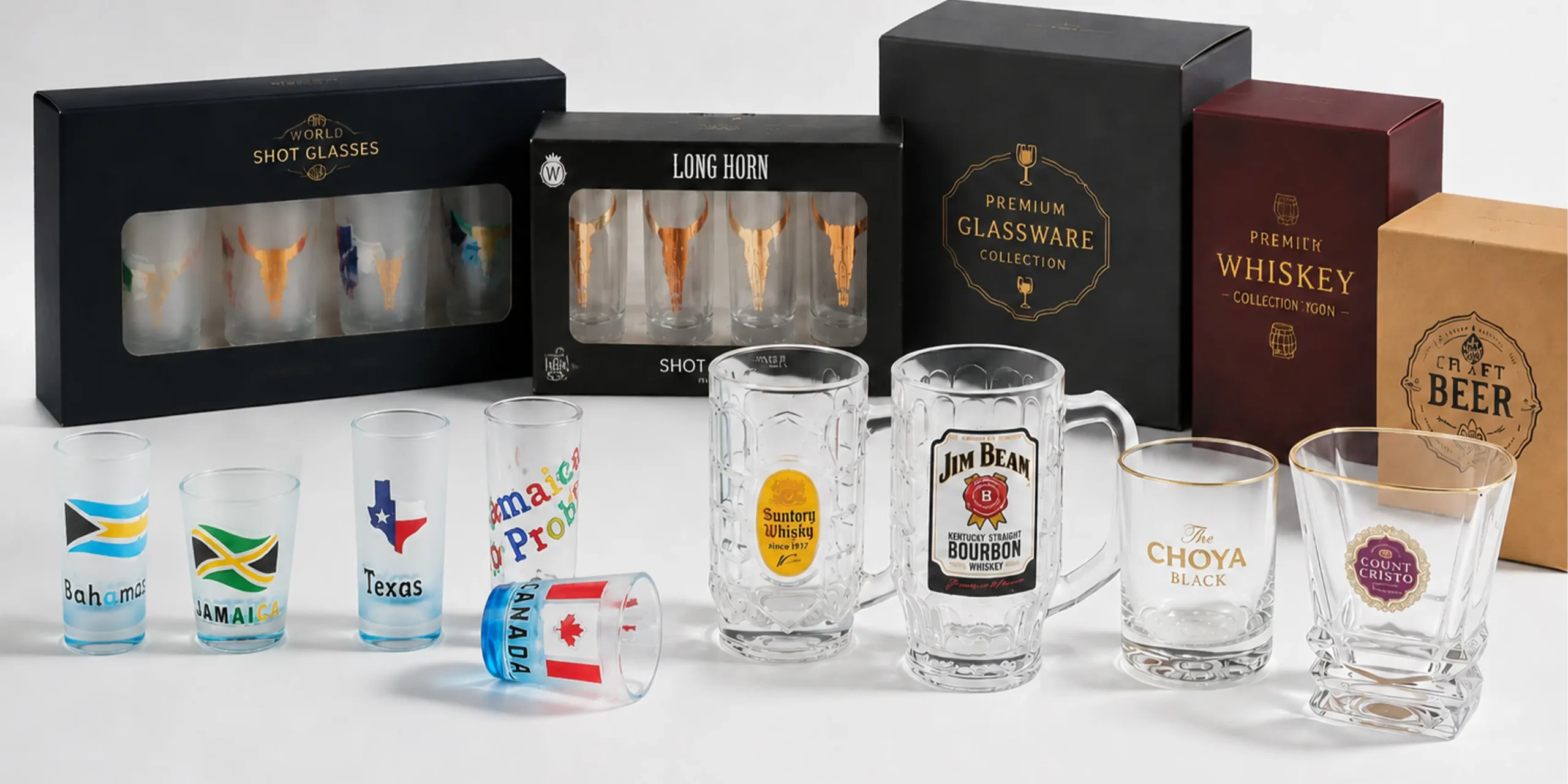 Custom printed glassware collection with bespoke gift packaging boxes, including shot glasses, beer mugs, and whiskey glasses.