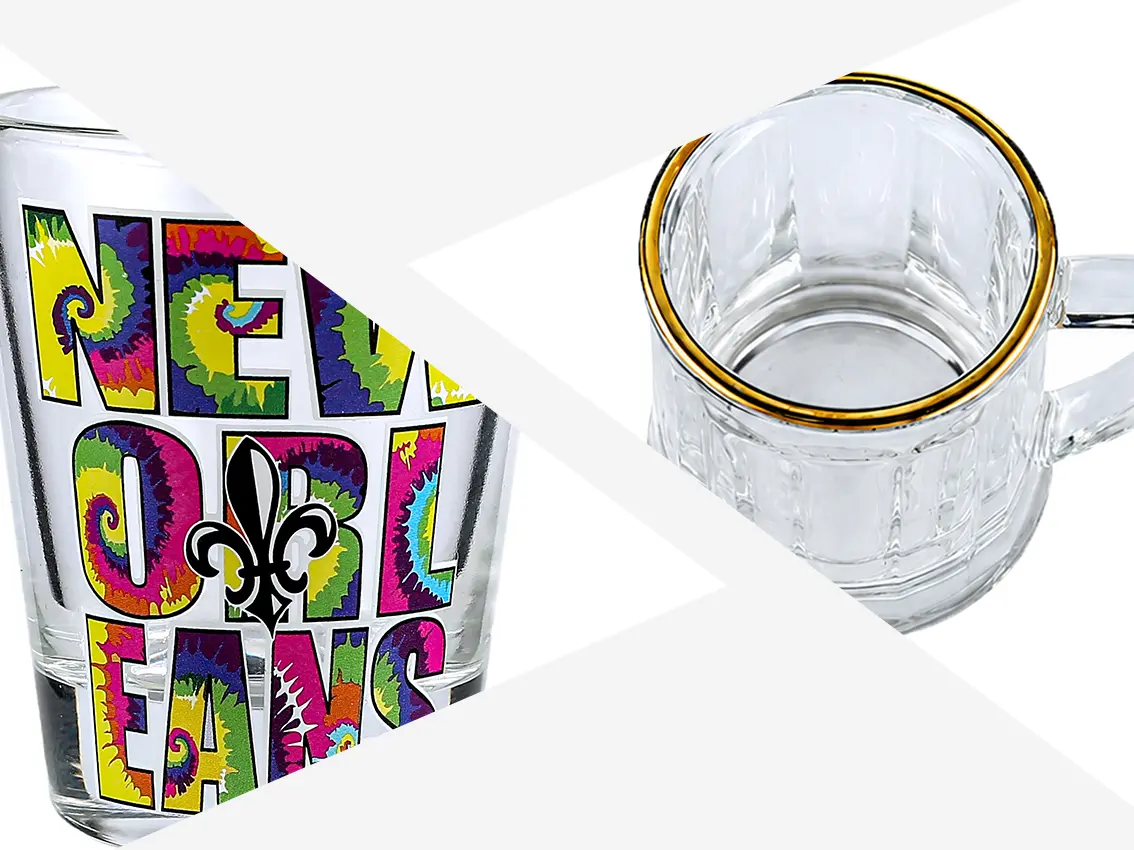 Custom printed shot glasses with colorful ceramic decals and premium gold rim craftsmanship.